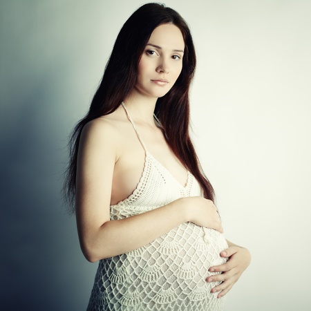 Fine art portrait of young pregnant womanの写真素材