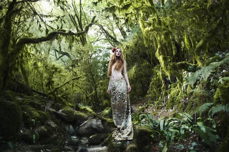 Portrait of romantic woman in fairy forestの写真素材