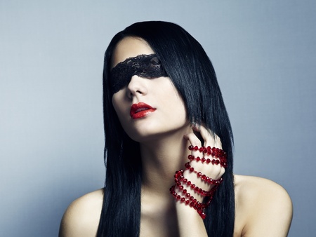 Fashion portrait of the young woman blindfoldの写真素材