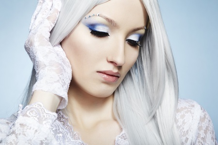 Fashion portrait of a young beautiful blonde woman. Winter Makeupの写真素材