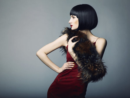 Fashion portrait of a young beautiful dark-haired woman
