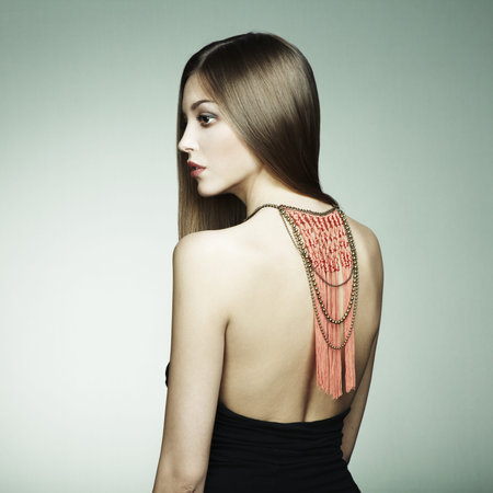 Portrait of young beautiful woman with long magnificent hair  Fashion photo