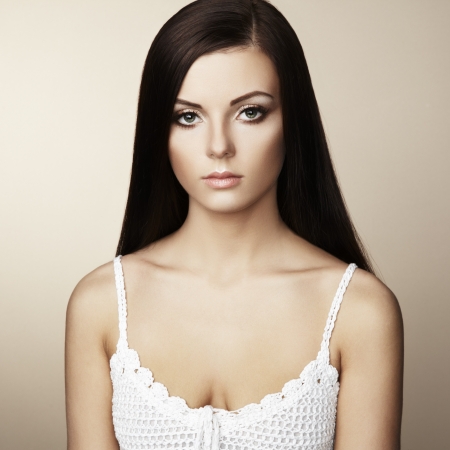 Fashion photo of beautiful woman with magnificent hair. Studio portraitの写真素材
