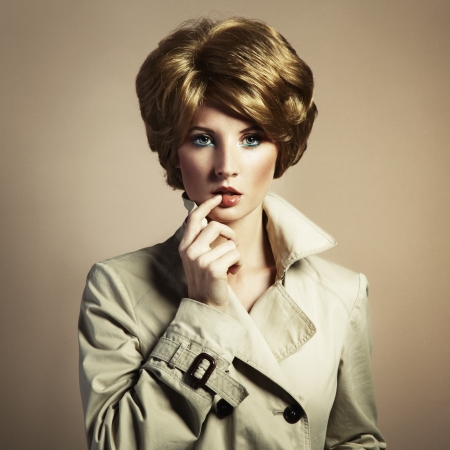 Portrait of beautiful sensual woman with elegant hairstyle. Retro hairdoの写真素材