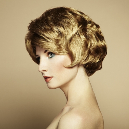 Portrait of beautiful sensual woman with elegant hairstyle. Retro hairdoの写真素材