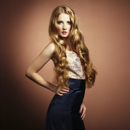 a beautiful woman with red hair in evening dress の写真素材