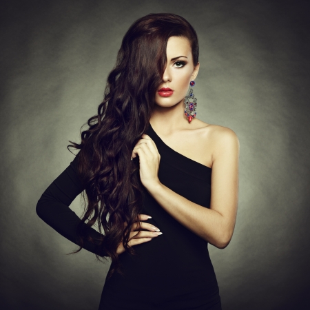 Portrait of beautiful brunette woman in black dress. 
の写真素材