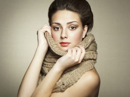 Portrait of a beautiful young woman with scarf. Fashion photoの写真素材
