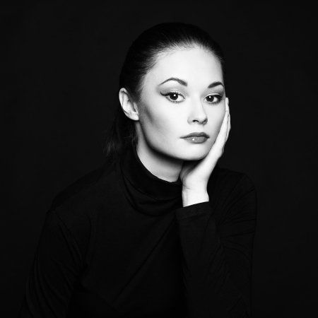 Mysterious portrait of a beautiful young woman. Black and white photoの写真素材