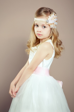 Portrait of little girl in luxurious dress. Fashion photoの写真素材