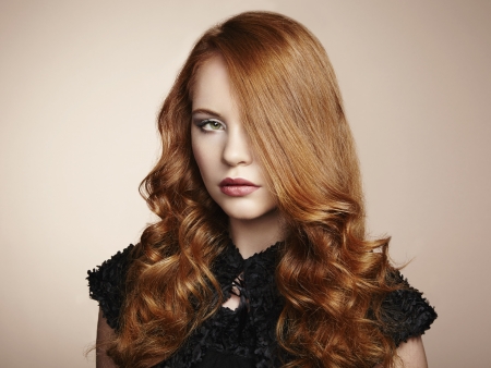 Portrait young beautiful woman with curly hair. Fashion photoの写真素材
