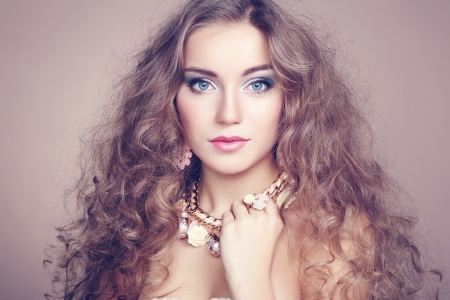 Portrait of young beautiful woman with jewelry. Beauty photoの写真素材