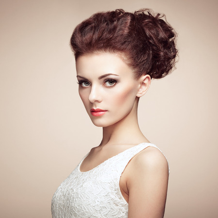 Portrait of beautiful sensual woman with elegant hairstyle.  Perfect makeup. Fashion photoの写真素材