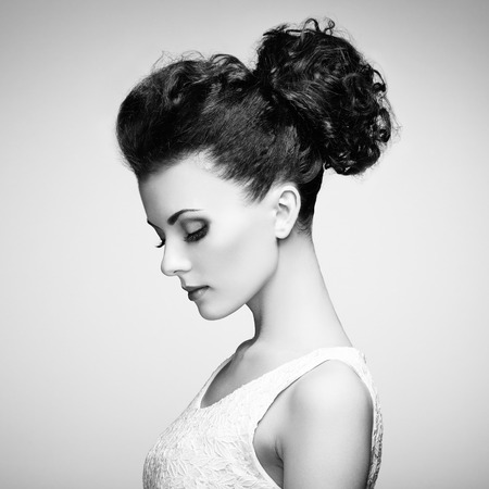 Portrait of beautiful sensual woman with elegant hairstyle.  Perfect makeup. Fashion photoの写真素材