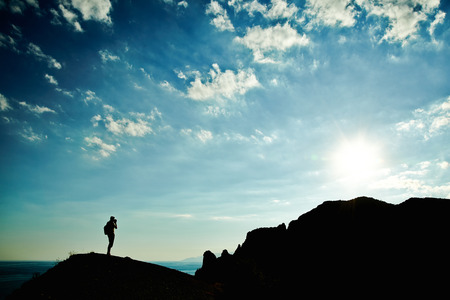 Man silhouette at sunset in mountains. Crimea landscapeの写真素材