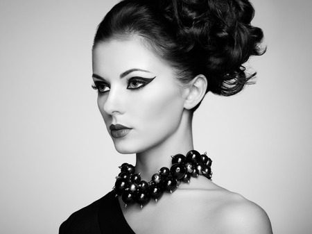 Portrait of beautiful sensual woman with elegant hairstyle.  Perfect makeup. Fashion photoの写真素材