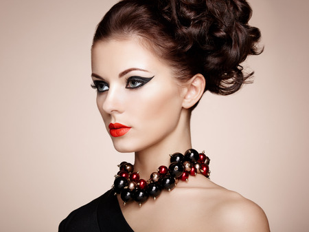Portrait of beautiful sensual woman with elegant hairstyle.  Perfect makeup. Fashion photoの写真素材