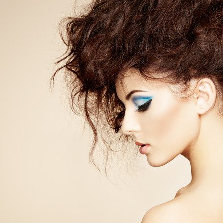 Portrait of beautiful sensual woman with elegant hairstyle.  Perfect makeup. Fashion photoの写真素材