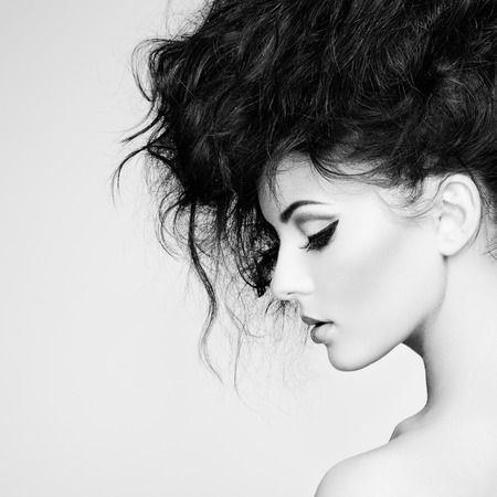 Portrait of beautiful sensual woman with elegant hairstyle.  Perfect makeup. Fashion photoの写真素材