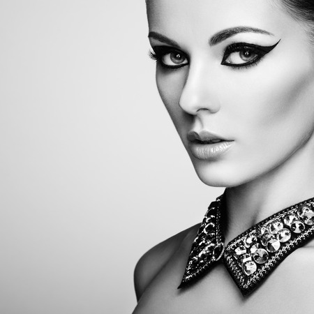 Portrait of beautiful sensual woman with elegant hairstyle. Diamond collar. Perfect makeup. Fashion photo. Black and Whiteの写真素材