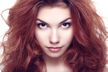 Fashion portrait of elegant woman with magnificent hair. Brunette girl. Perfect make-up. Girl on white background. Curly hairの写真素材