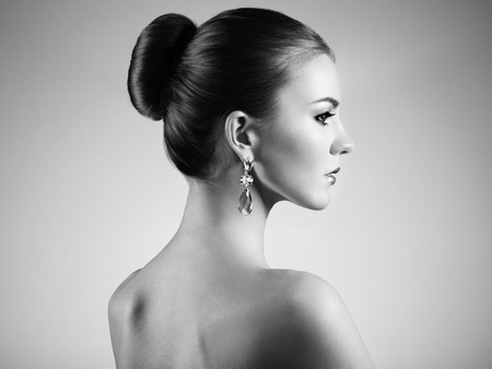 Portrait of beautiful sensual woman with elegant hairstyle.  Perfect makeup. Brunette girl. Fashion photoの写真素材