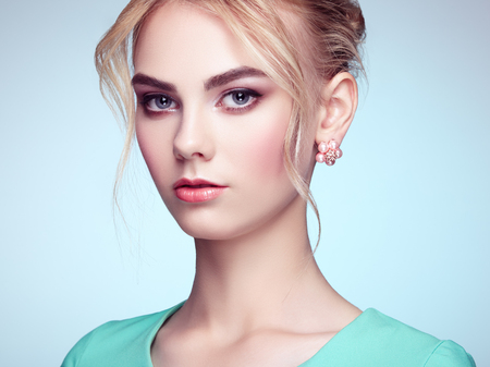 Portrait of beautiful sensual woman with elegant hairstyle.  Perfect makeup. Blonde girl. Fashion photoの写真素材