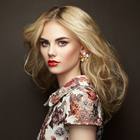 Portrait of beautiful sensual woman with elegant hairstyle. Perfect makeup. Blonde girl. Fashion photo. Jewelry and dress Portrait of beautiful sensual woman with elegant hairstyle. Perfect makeup. Blonde girl. Fashion photo. Jewelry and dress