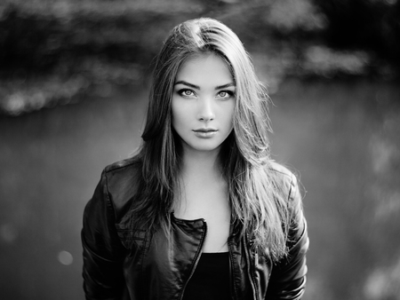 Portrait of young beautiful woman in leather jacket. Fashion photoの写真素材