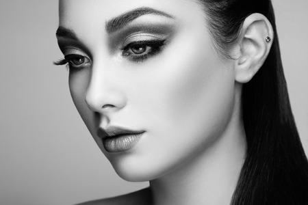 Beautiful woman face. Perfect makeup. Beauty fashion. Eyelashes. Lips. Cosmetic Eyeshadowの写真素材