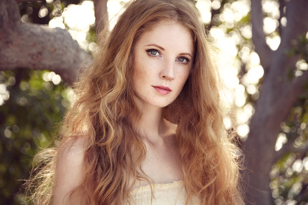 Portrait of a beautiful young woman in summer garden. Girl on nature. Spring mood.  Fashion beautyの写真素材