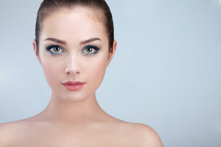 Beautiful woman face. Perfect makeup. Beauty fashion. Eyelashes. Lips. Cosmetic Eyeshadow. Perfect skinの写真素材