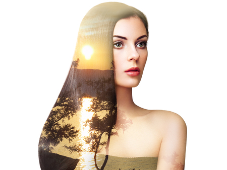 Double exposure photo of beautiful woman with long hair. Girl with perfect makeup and hairstyle.の写真素材