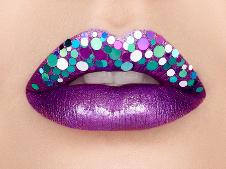 Close up view of Beautiful Woman Lips with Purple Lipstick. Open Mouth with white Teeth. Cosmetology, drugstore or Fashion Makeup Concept.  Beauty studio shot. Passionate Kissの写真素材
