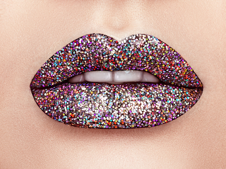 Close up view of Beautiful Woman Lips with Colorful Lipstick. Open Mouth with white Teeth. Cosmetology, drugstore or Fashion Makeup Concept.  Beauty studio shot. Passionate Kissの写真素材