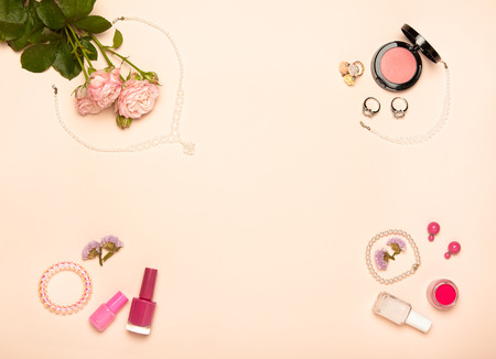 Fashionable Women's Cosmetics and Accessories. Falt Lay. Nail Polish and blush. Jewelry and Rings. A bouquet of flowers. Pink rosesの写真素材
