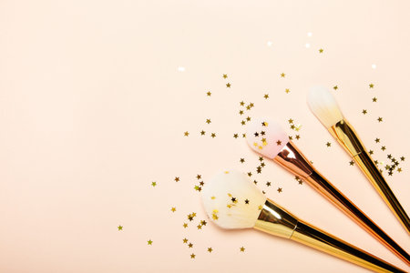 Fashionable Women's Cosmetics and Accessories. Falt Lay. Gold Stars. Make-Up Brushes. Make Up...