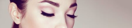 Female Eye with Extreme Long False Eyelashes. Eyelash Extensions. Makeup, Cosmetics, Beauty. Close up, Macroの写真素材