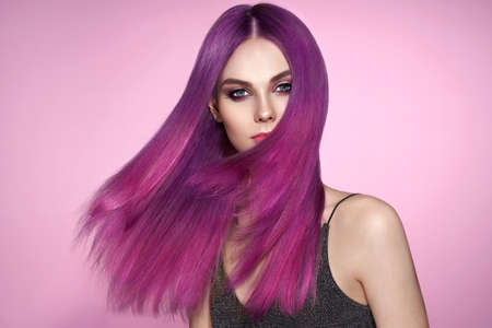 Beauty Fashion Model Girl with Colorful Dyed Hair. Girl with Perfect Makeup and Hairstyle. Model with Perfect Healthy Dyed Hairの写真素材