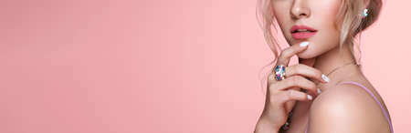 Beauty Woman with perfect Makeup and Manicure. Glamour Girl with Jewelry.の写真素材