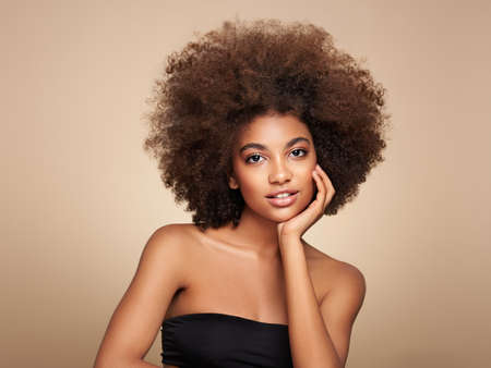 Beauty portrait of African American girl with afro hair. Beautiful black woman. Cosmetics, makeup and fashionの写真素材