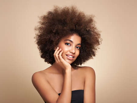 Beauty portrait of African American girl with afro hair. Beautiful black woman. Cosmetics, makeup and fashionの写真素材