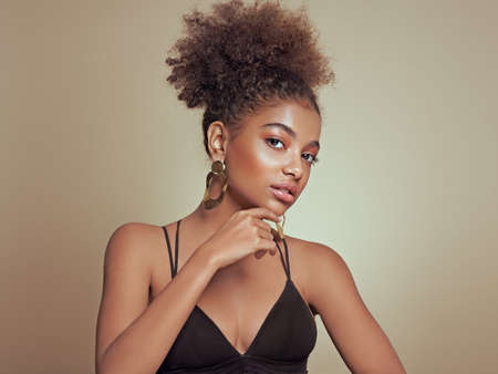 Beauty portrait of African American girl with afro hair. Beautiful black woman. Cosmetics, makeup and fashionの写真素材
