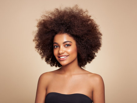 Beauty portrait of African American girl with afro hair. Beautiful black woman. Cosmetics, makeup and fashionの写真素材