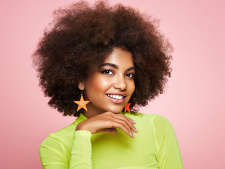 Beauty portrait of African American girl with afro hair. Beautiful black woman. Cosmetics, makeup and fashionの写真素材
