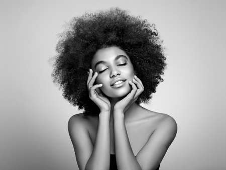 Beauty portrait of African American girl with afro hair. Beautiful black woman. Cosmetics, makeup and fashionの写真素材