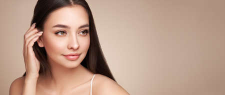 Portrait beautiful young woman with clean fresh skin. Model with healthy skin, close up portrait. Cosmetology, beauty and spaの写真素材