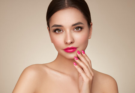 Portrait beautiful young woman with clean fresh skin. Model with healthy skin, close up portrait. Cosmetology, beauty and spaの写真素材