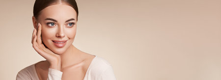 Portrait beautiful young woman with clean fresh skin. Model with healthy skin, close up portrait. Cosmetology, beauty and spaの写真素材