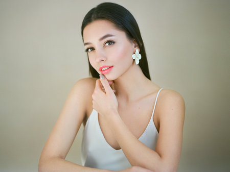 Portrait beautiful young woman with clean fresh skin. Model with healthy skin, close up portrait. Cosmetology, beauty and spa. Film photographyの写真素材